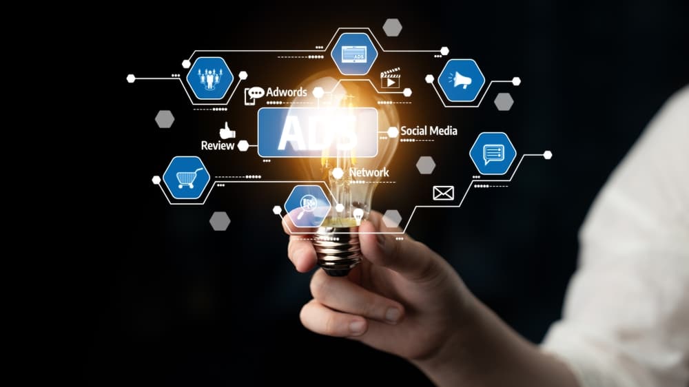 A,Person,Hand,Holds,A,Glowing,Light,Bulb,,Symbolizing,Bright